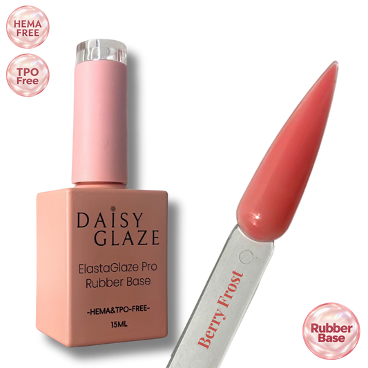 Berry Frost tinted rubber base by Daisy Glaze in warm coral pink, shown beside the bottle