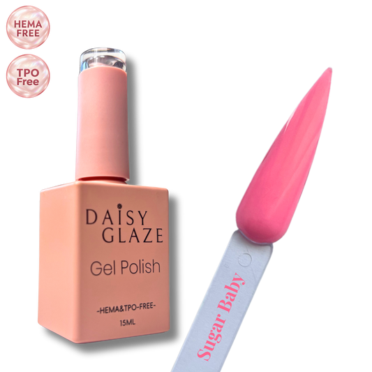 Sugar Baby gel polish by Daisy Glaze in warm coral pink, shown beside the bottle