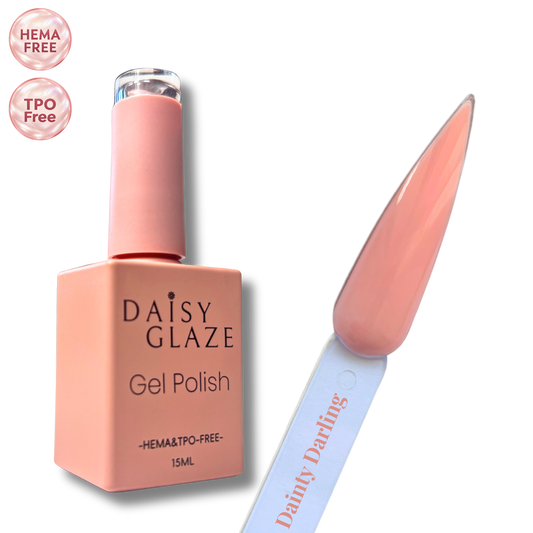 Dainty Darling gel polish by Daisy Glaze in soft peachy pink, shown beside the bottle