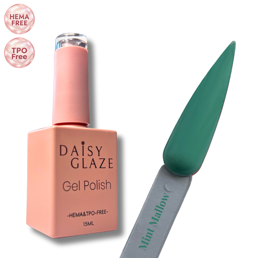Mint Mallow gel polish by Daisy Glaze in deep emerald green, shown beside the bottle