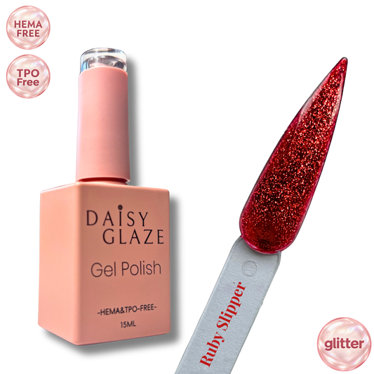 Ruby Slipper gel polish by Daisy Glaze in ruby red glitter, shown beside the bottle