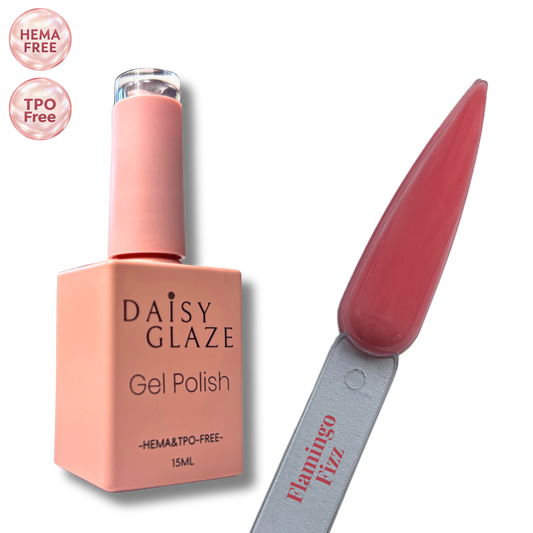 Flamingo Fizz gel polish by Daisy Glaze in rosy coral-red, shown beside the bottle