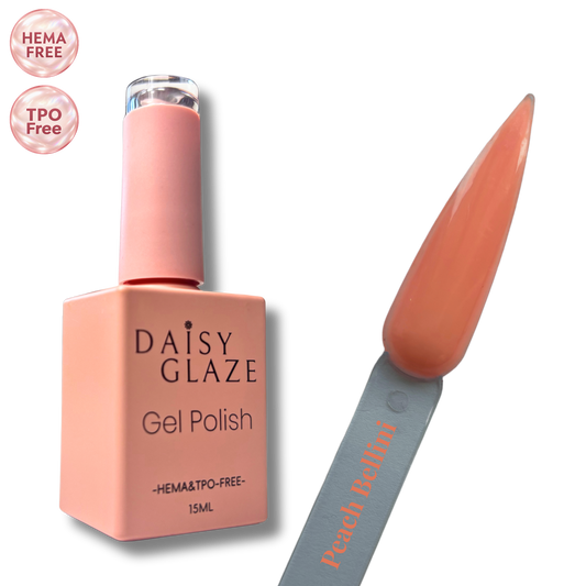 Peach Bellini gel polish by Daisy Glaze in warm peachy coral, shown beside the bottle
