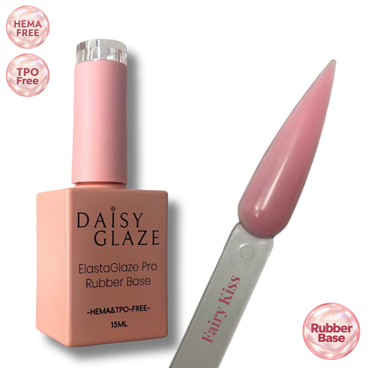 Fairy Kiss tinted rubber base by Daisy Glaze in sheer milky pink, shown beside the bottle
